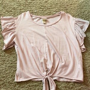 Super cute ruffle sleeves and tie at bottom.